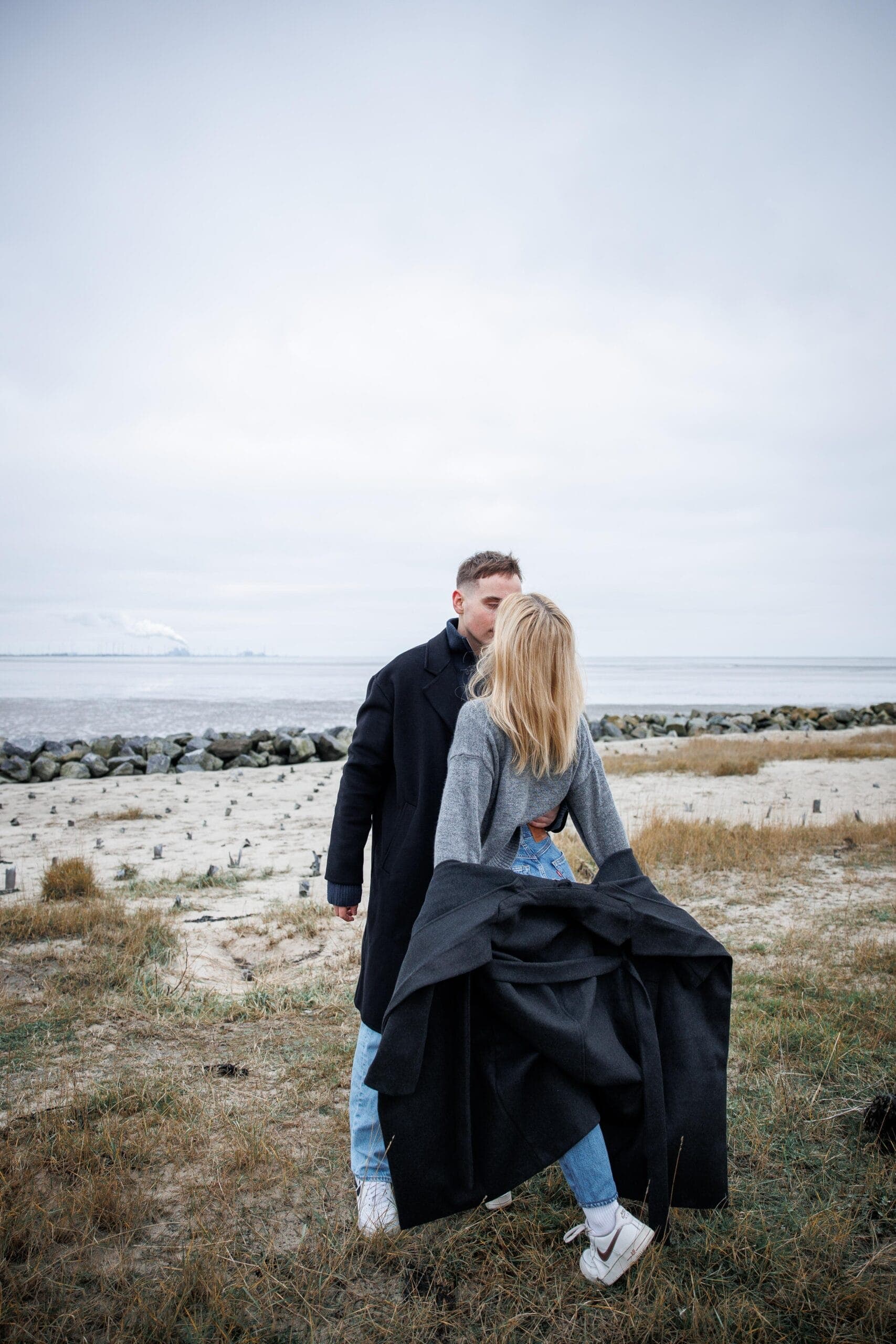 Open fields, wide sky, and two people entirely at ease with one another.