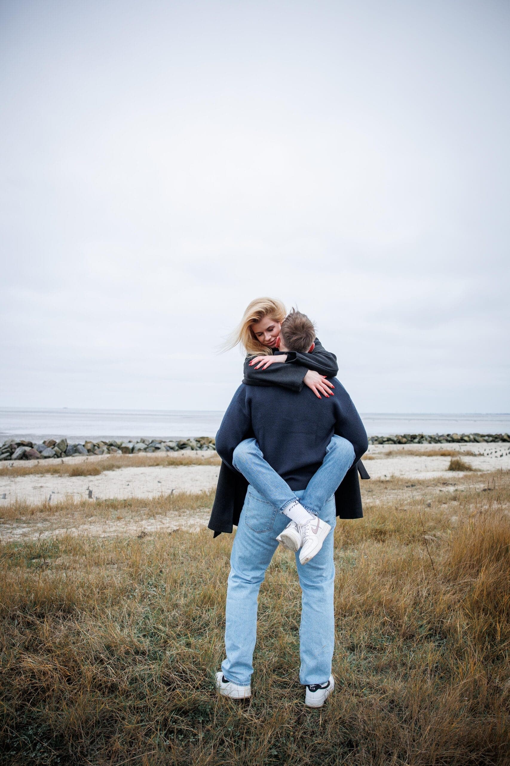 Open fields, wide sky, and two people entirely at ease with one another.