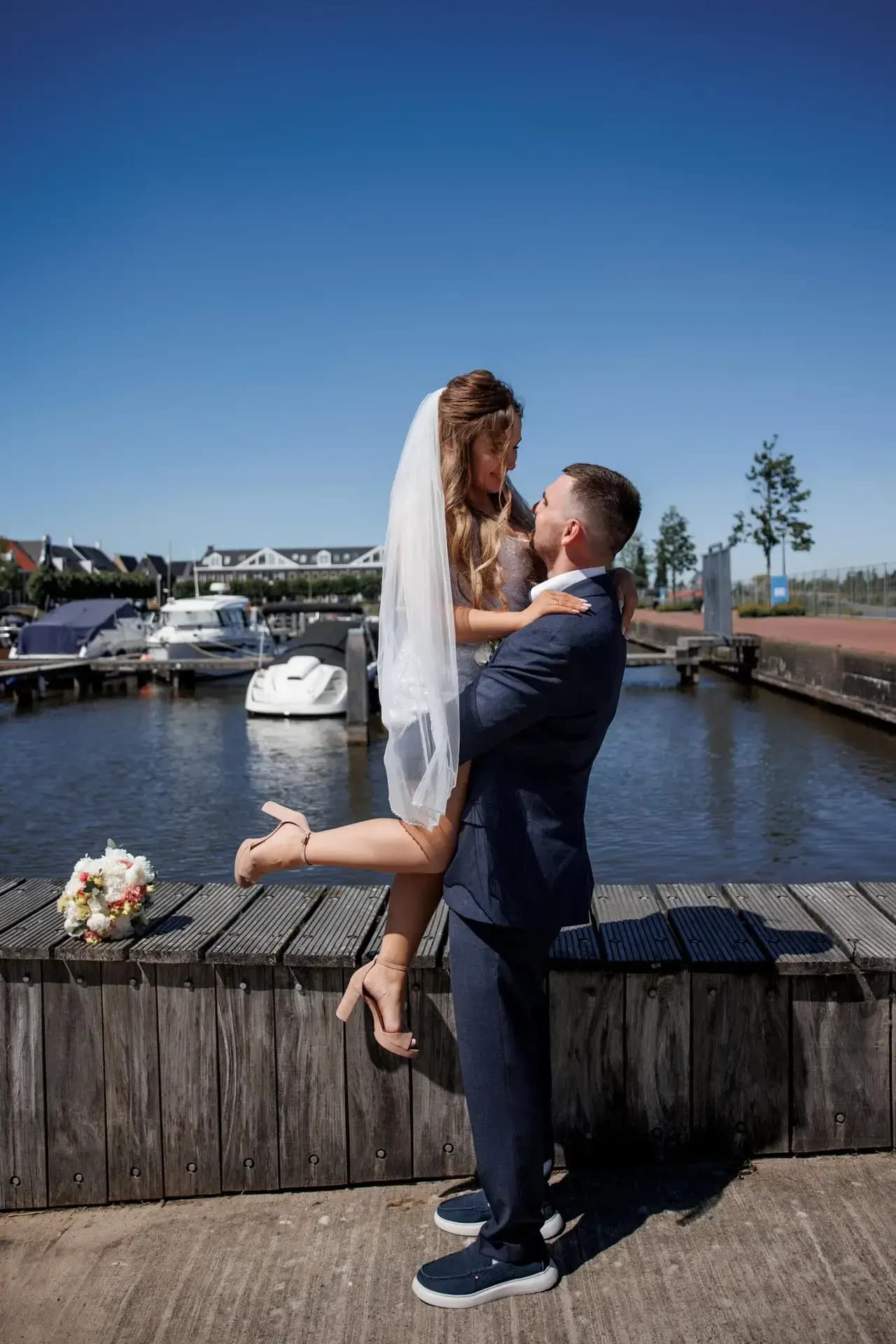 A celebration beside the water in Blauwestad, where afternoon light turned silver across the harbour.