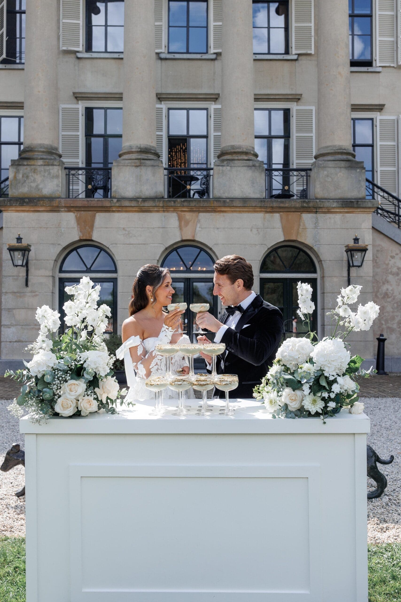An estate celebration framed by old gardens and quiet luxury.