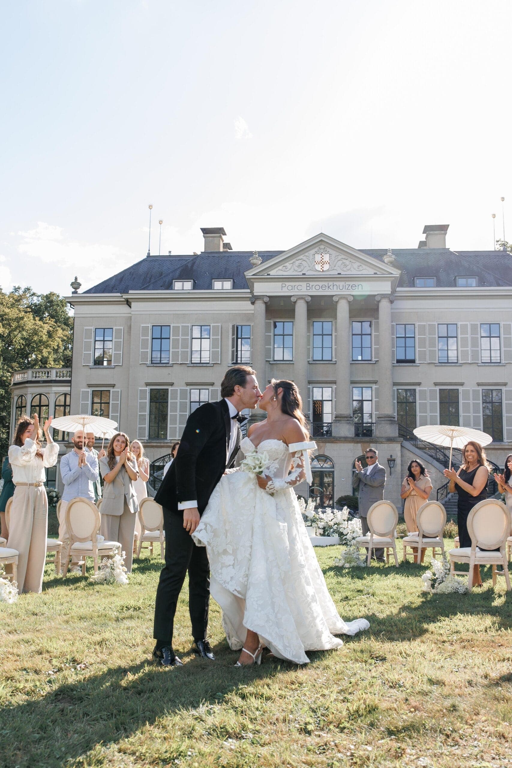 An estate celebration framed by old gardens and quiet luxury.