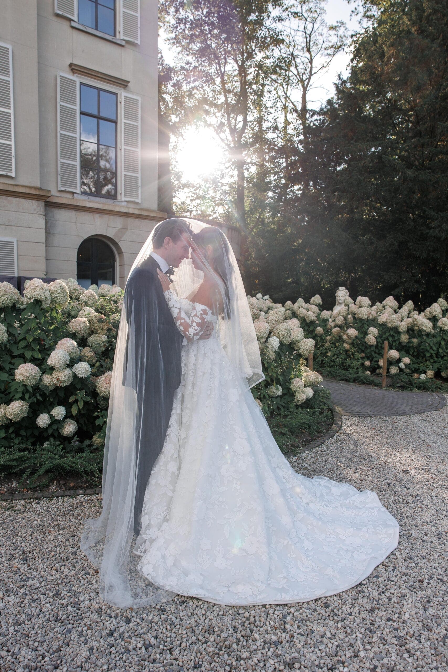 An estate celebration framed by old gardens and quiet luxury.
