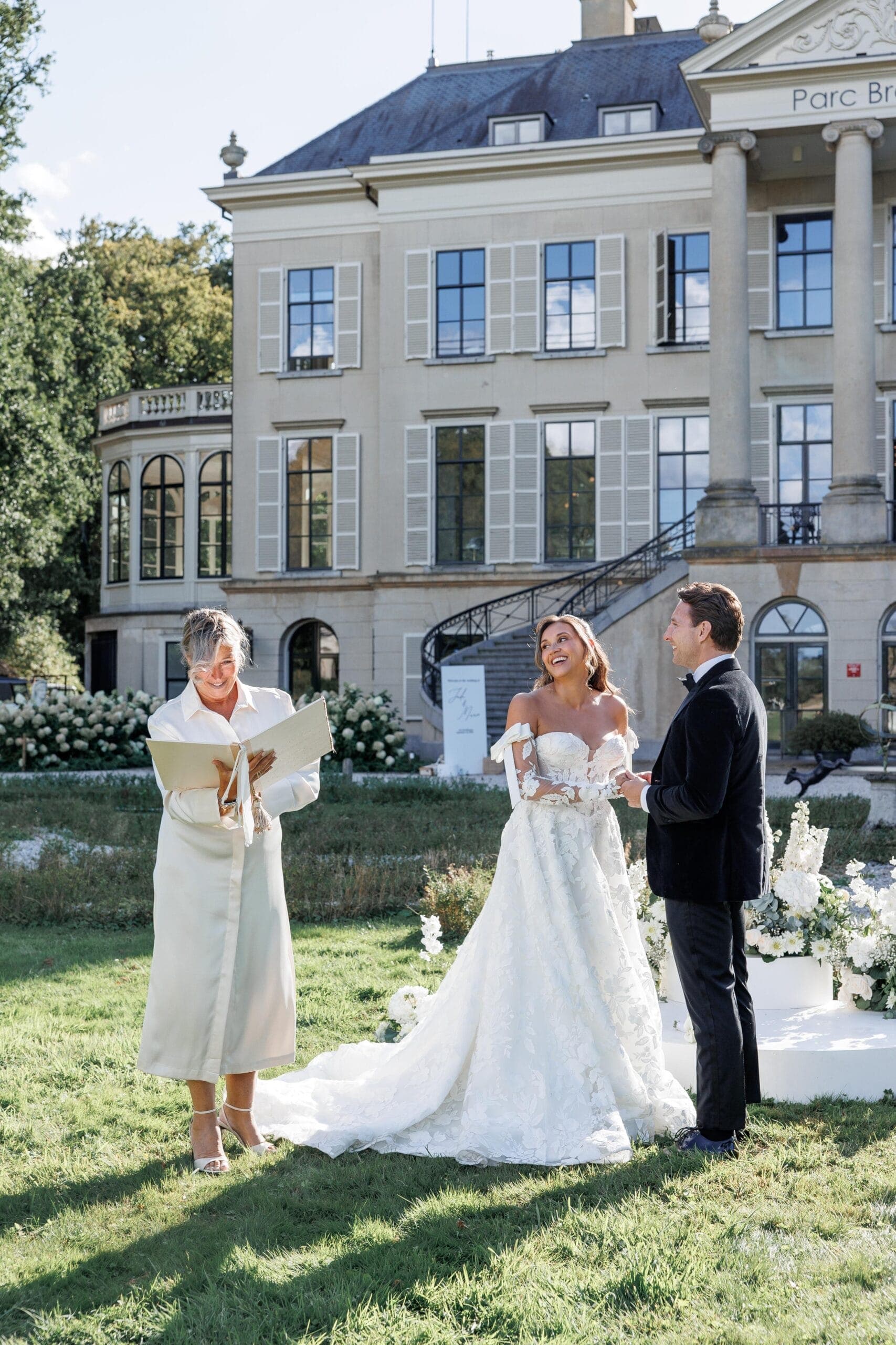 An estate celebration framed by old gardens and quiet luxury.